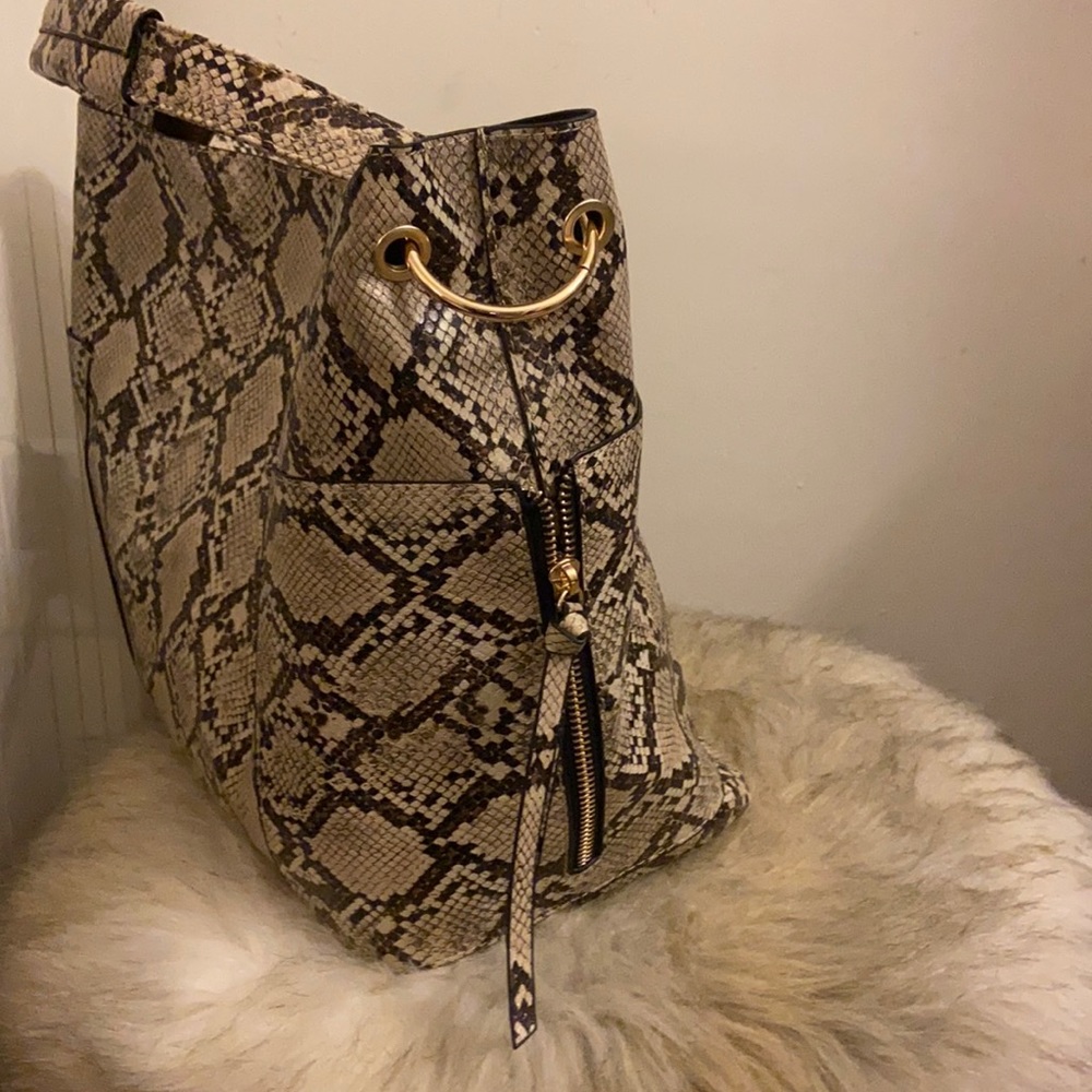 Snakeskin print bag with matching make up bag.